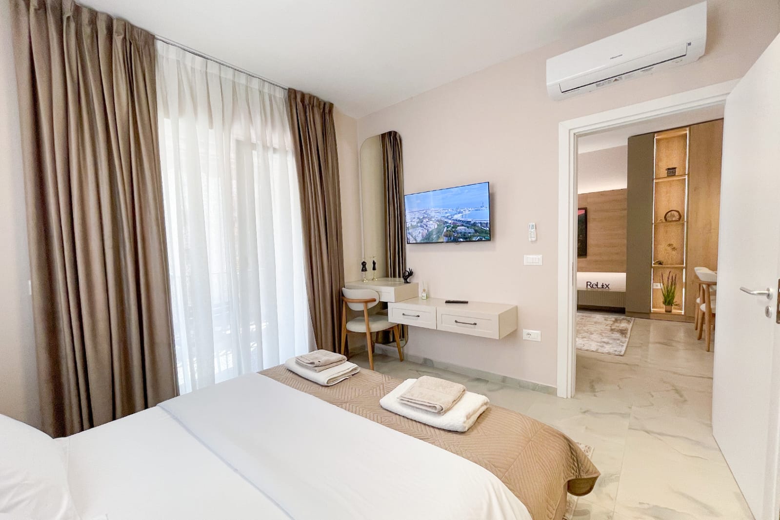 Master bedroom — double bed with smart TV and air conditioning