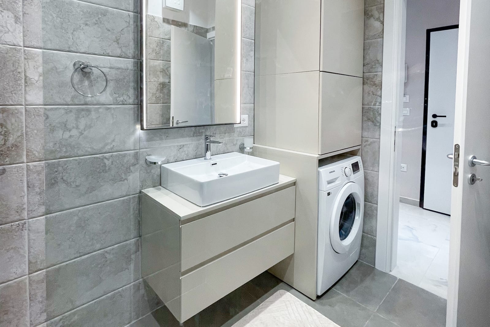 Bathroom — vanity, mirror and washing machine